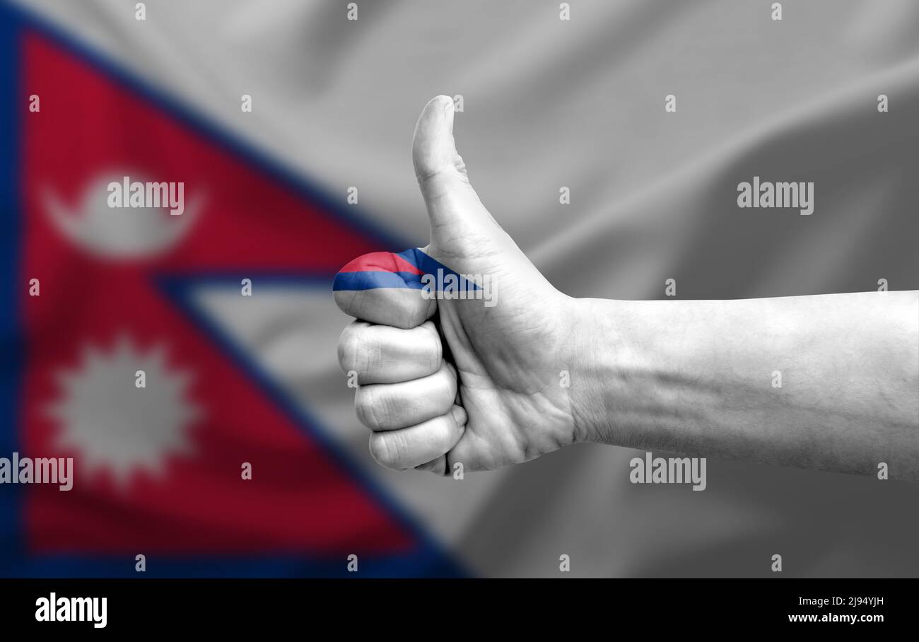 Hand making thumb up painted with flag of nepal Stock Photo - Alamy