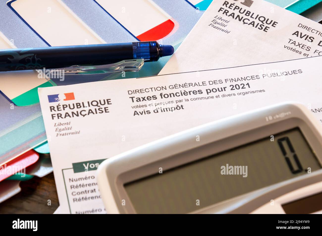 french tax document with calculator and pen Stock Photo