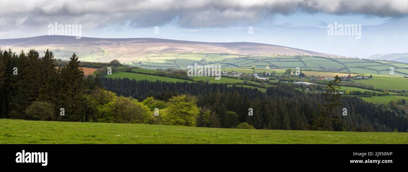 The village of Cutcombe below Dunkery Hill viewed from White Moor in the Brendon Hills, Exmoor National Park, Somerset, England. Stock Photo