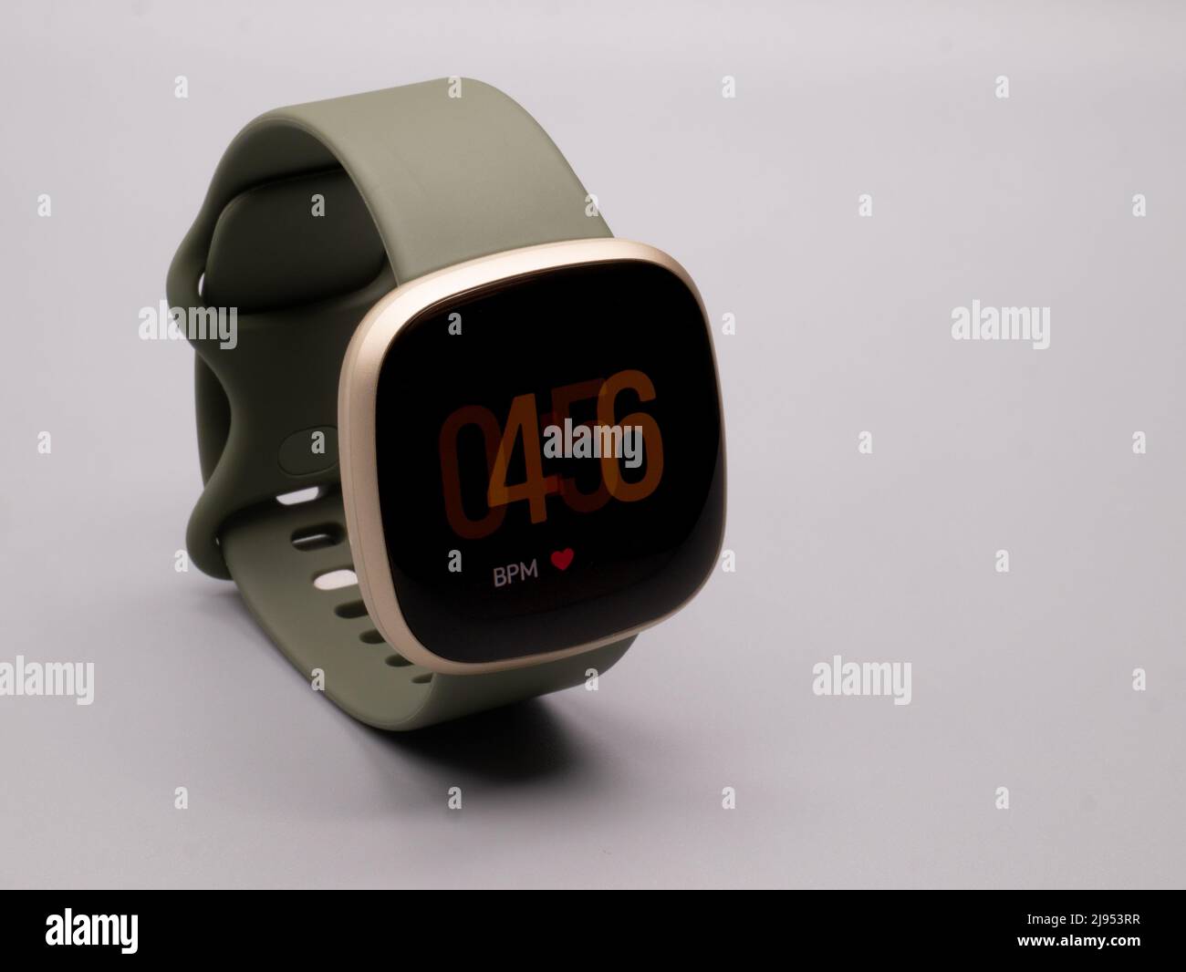 May 2022, UK: Fitbit Versa 3 Olive Green Watch Face with BMP Heart Rate with Display on Stock Photo