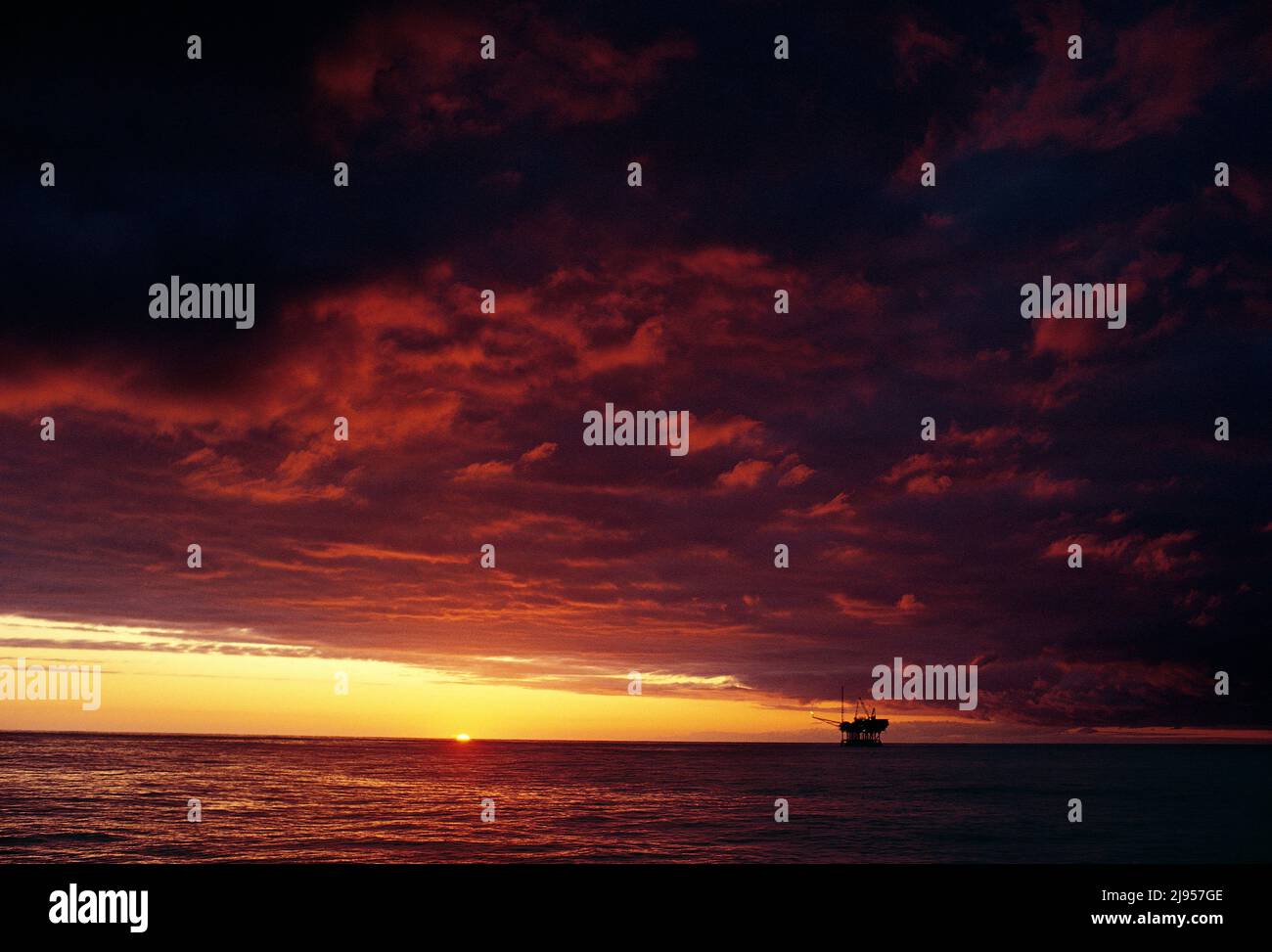 Australia. Bass Strait. Off shore oil and gas field and rig at sunrise. Stock Photo