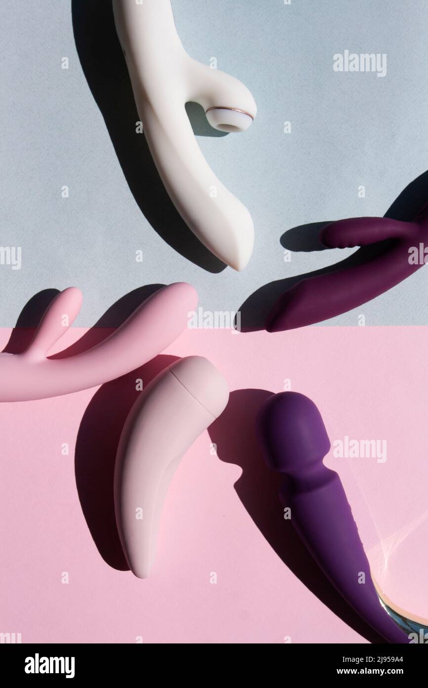 Collection of different types of sex toys on a blue and pink background. Sex  toys for adults, dildos, vibrators, clitoral stimulators Stock Photo - Alamy