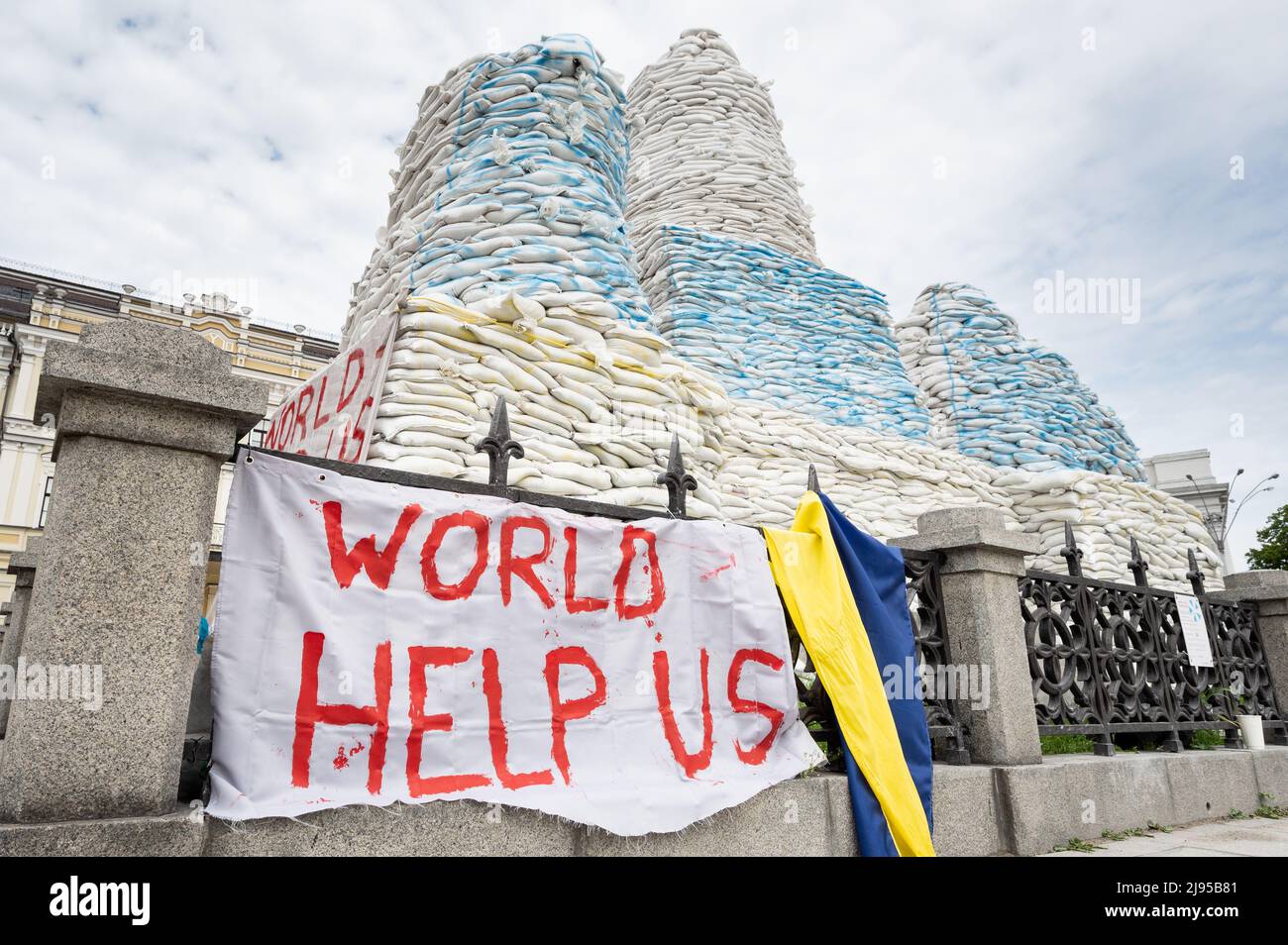 Kyiv, Ukraine. 20th May, 2022. A banner that reads 'World help us' near sandbags stacked around the Princess Olga Monument (near St. Michael's Golden-Domed Monastery) to protect it during the Ukrainian Russian war. Credit: SOPA Images Limited/Alamy Live News Stock Photo