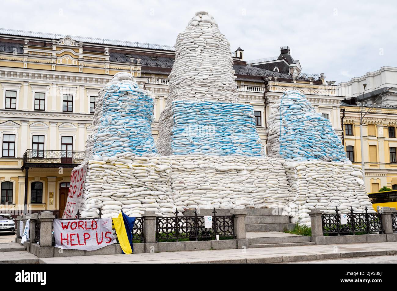 Kyiv, Ukraine. 20th May, 2022. A banner that reads 'World help us' near sandbags stacked around the Princess Olga Monument (near St. Michael's Golden-Domed Monastery) to protect it during the Ukrainian Russian war. Credit: SOPA Images Limited/Alamy Live News Stock Photo