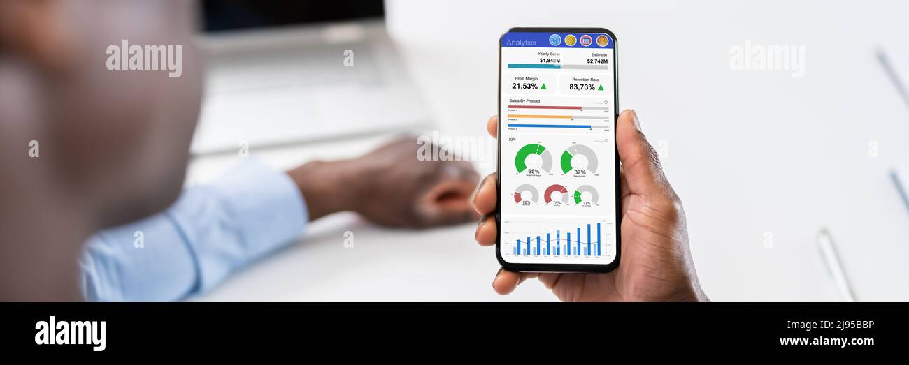African American Financial Analyst Looking At Data On Data Stock Photo