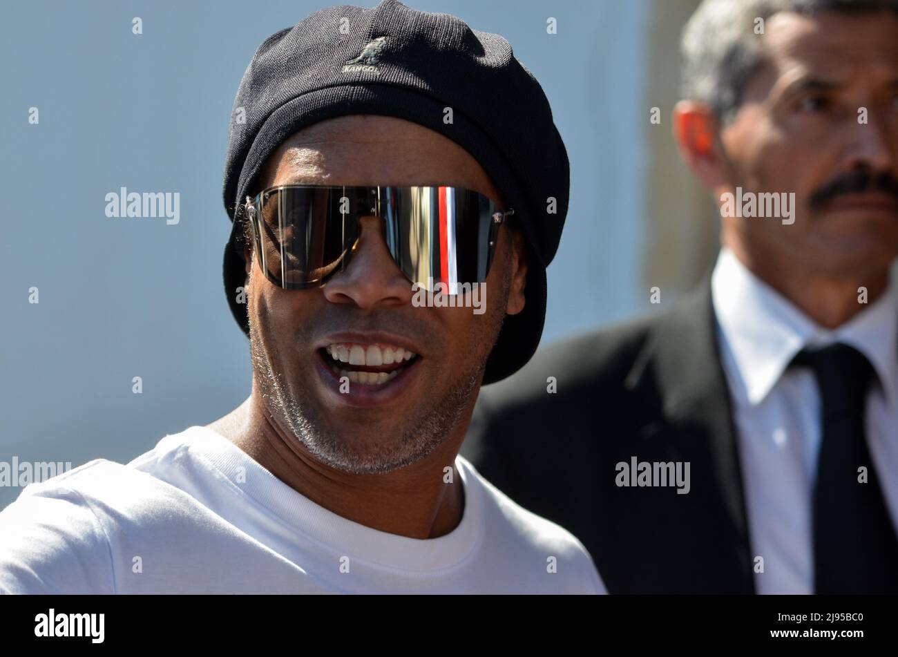 Tunis, Tunisia. 20th May, 2022. May 20, 2022, Sidi Bou Said, Tunis governorate, Tunisia: Tunis, Tunisia. 20 May 2022: Brazilian retired professional footballer Ronaldinho arrives at the Tunisian northern town of Sidi Bou Said on a visit to the country. Ronaldo de Assis Moreira, commonly known as Ronaldinho GaÃºcho, walked in the alleys of the picturesque tourist town accompanied by Tunisian officials (Credit Image: © Hasan Mrad/IMAGESLIVE via ZUMA Press Wire) Credit: ZUMA Press, Inc./Alamy Live News Stock Photo