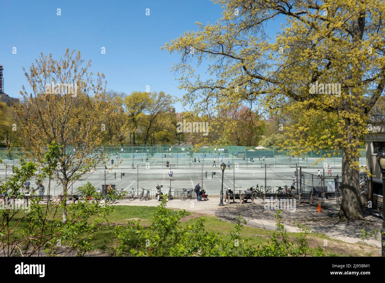 Players enjoying a spring afternoon at Central Park Tennis Center in New York City, USA  2022 Stock Photo