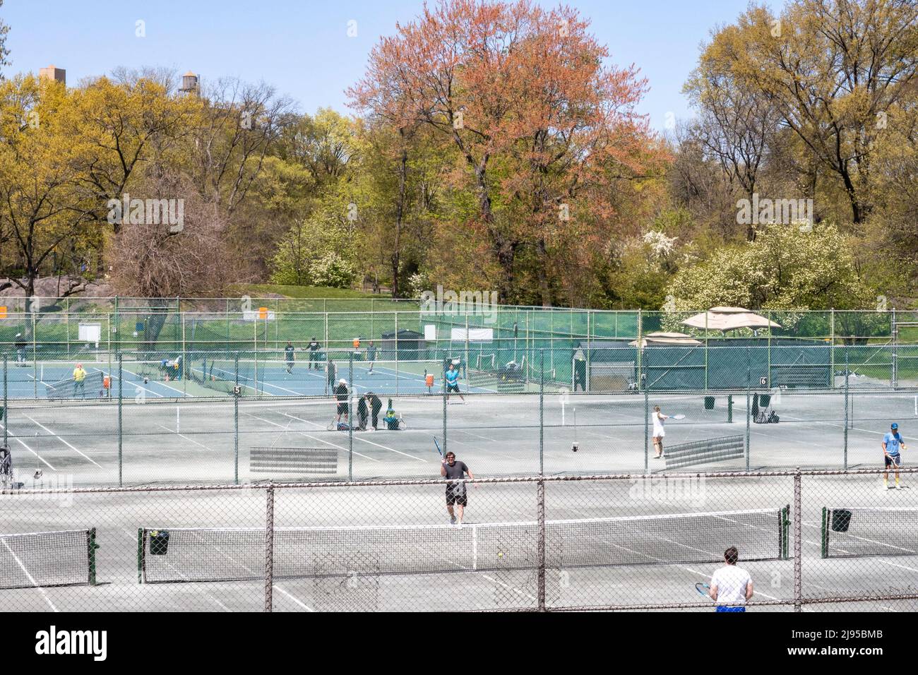Players enjoying a spring afternoon at Central Park Tennis Center in ...
