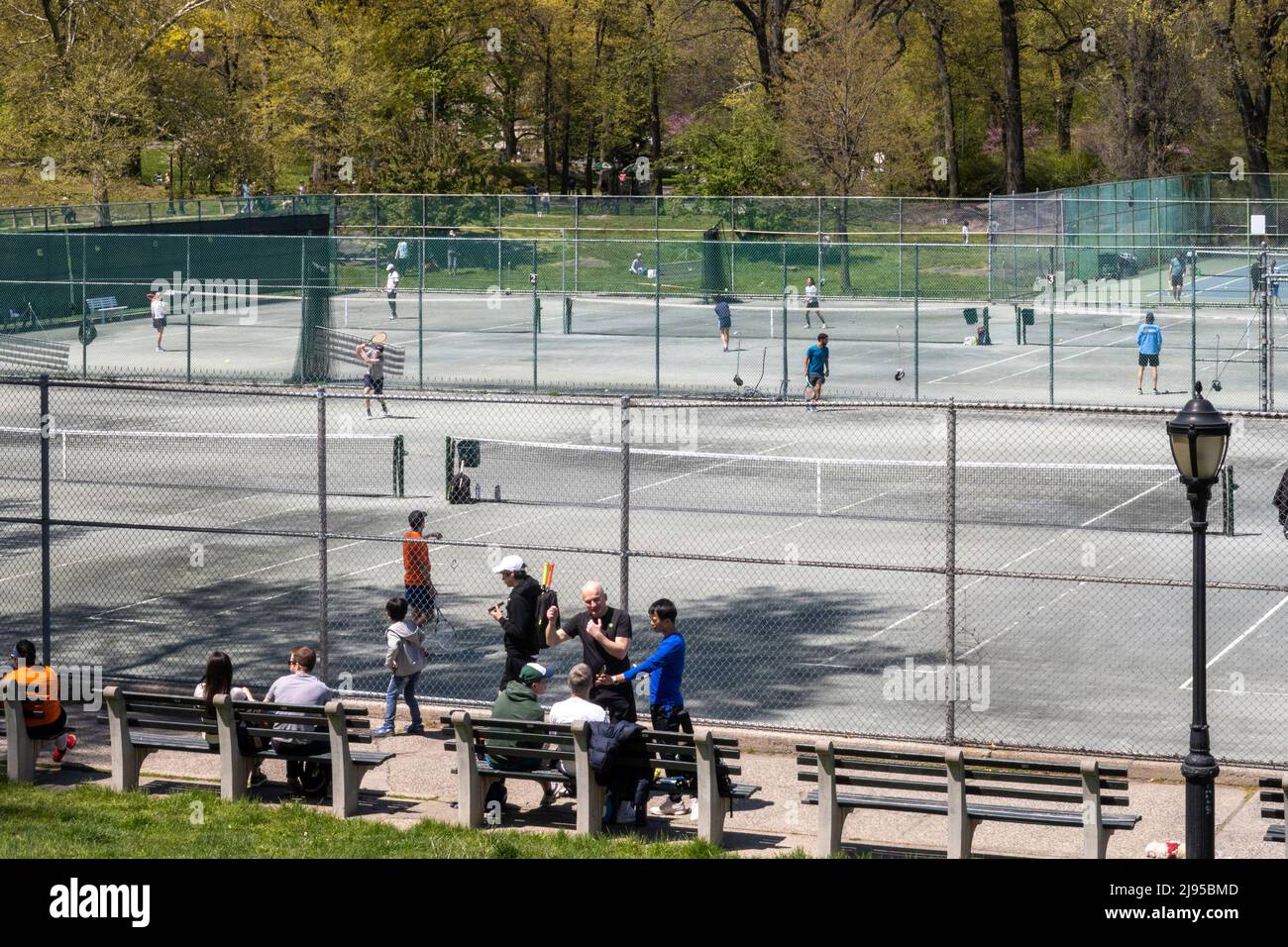 Players enjoying a spring afternoon at Central Park Tennis Center in