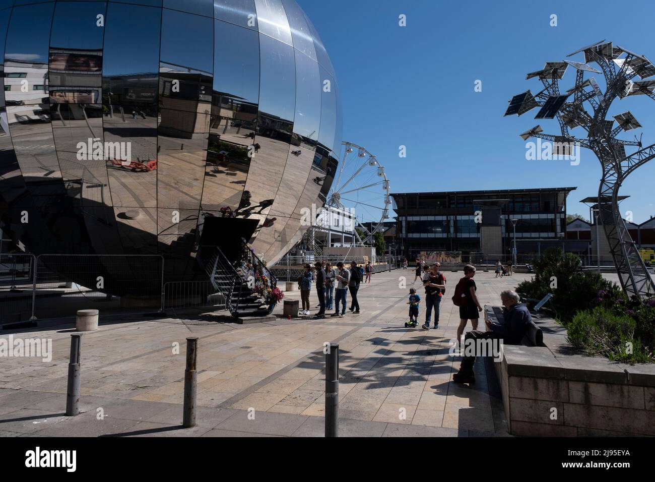 Mirror sphere in Millennuim Square which was built as part of the At Bristol development, and has become a popular public area on 7th May 2022 in Bristol, United Kingdom. Stock Photo