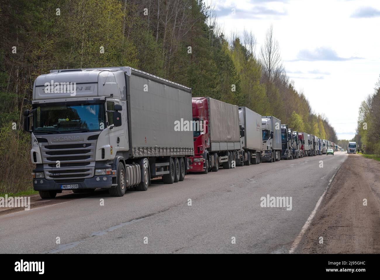 PSKOV REGION, RUSSIA - MAY 08, 2022: European trucks are queuing to cross the Russian-Estonian border Stock Photo