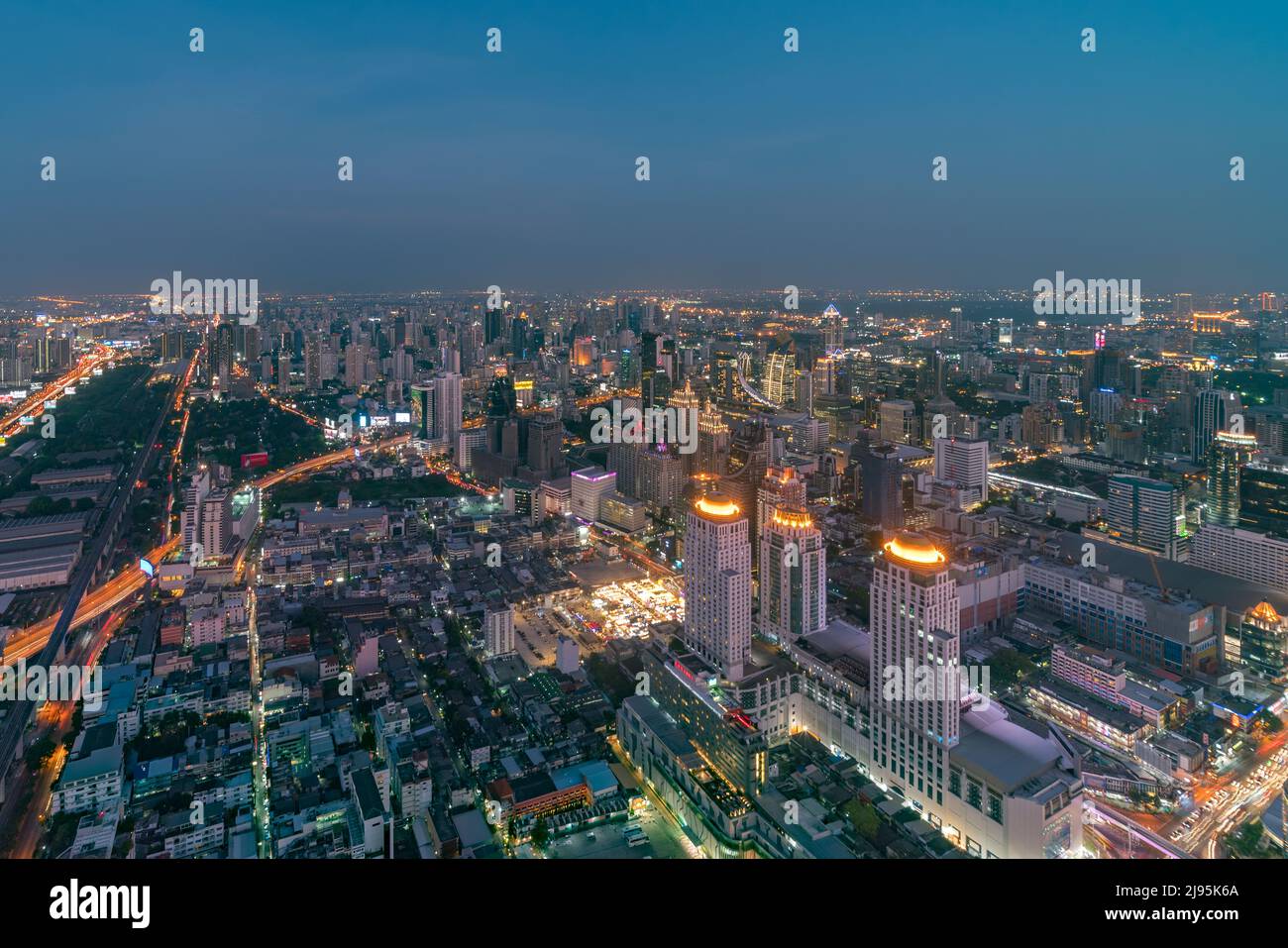 The city skyline of Bangkok Thailand and its skyscrapers at sunset Stock Photo