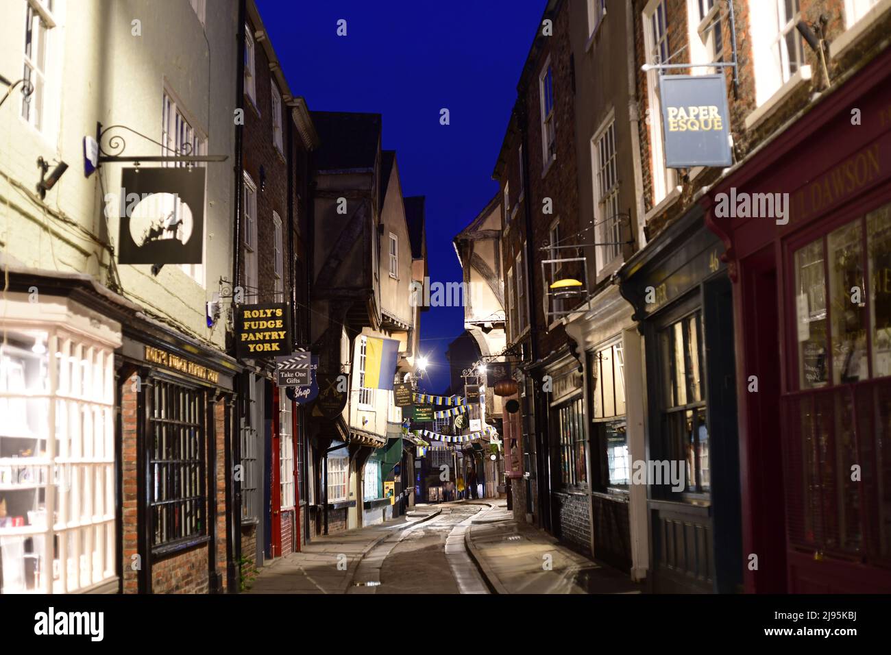 overhanging timber framed buildings in the shambles in york at twilight yorkshire united kingdom Stock Photo