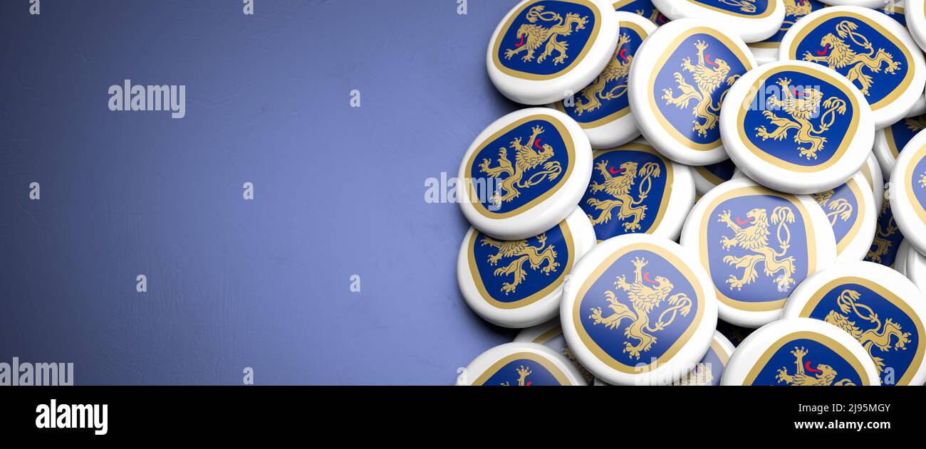 Logos of the Munich brewery Löwenbräu on a heap on a table. Only Munich breweries are allowed on the Oktoberfest. Copy space. Web banner format. Stock Photo