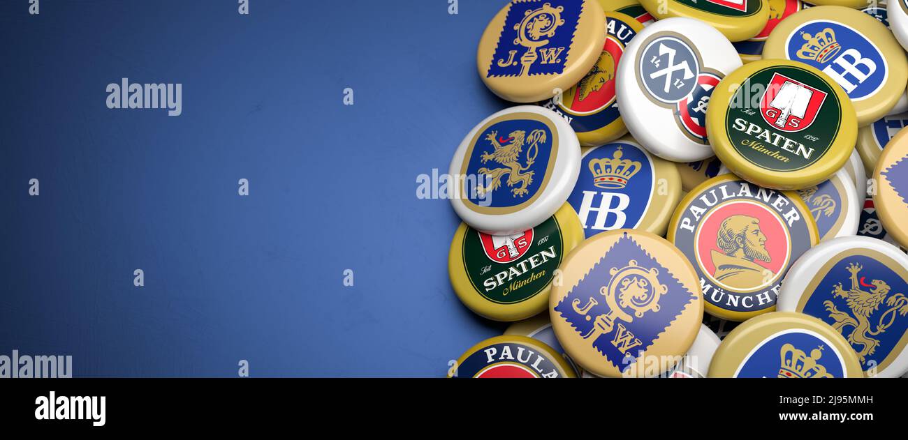 Logos of the Munich breweries allowed on the Oktoberfest: Augustiner, Löwenbräu, Hacker-Pschorr, Spaten, Paulaner and Hofbräu on a heap on a table. Co Stock Photo