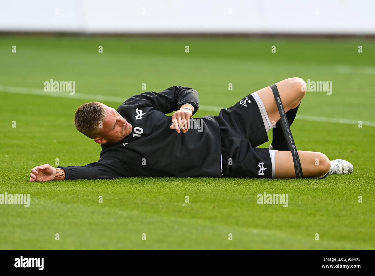 Gareth of Ospreys stretches during pre match warm up Stock