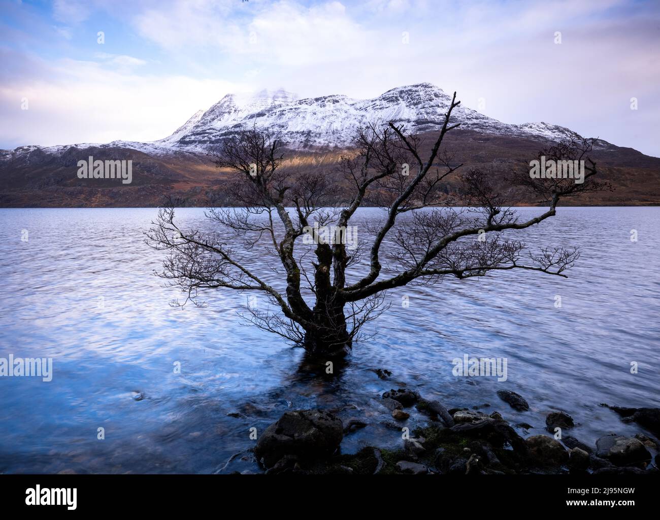 Slioch towering over Loch Maree in winter, Wester Ross, Scotland, UK Stock Photo