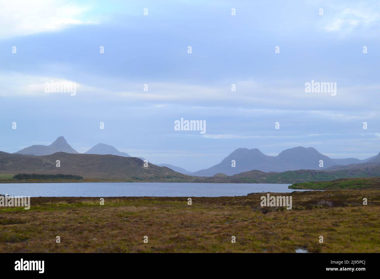 Wild mountain scenery in NW Scotland. Stac Poillaidh, on left, Cul Mor, on right, early evening, Scotland's Monument Valley, lonely wilderness Stock Photo