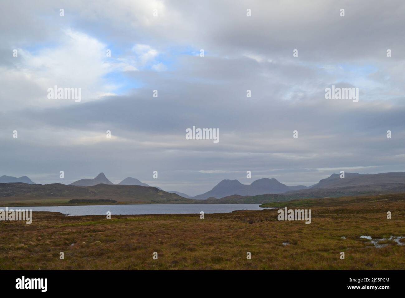 Wild mountain scenery in NW Scotland. Stac Poillaidh, on left, Cul Mor, on right, early evening, Scotland's Monument Valley, lonely wilderness Stock Photo