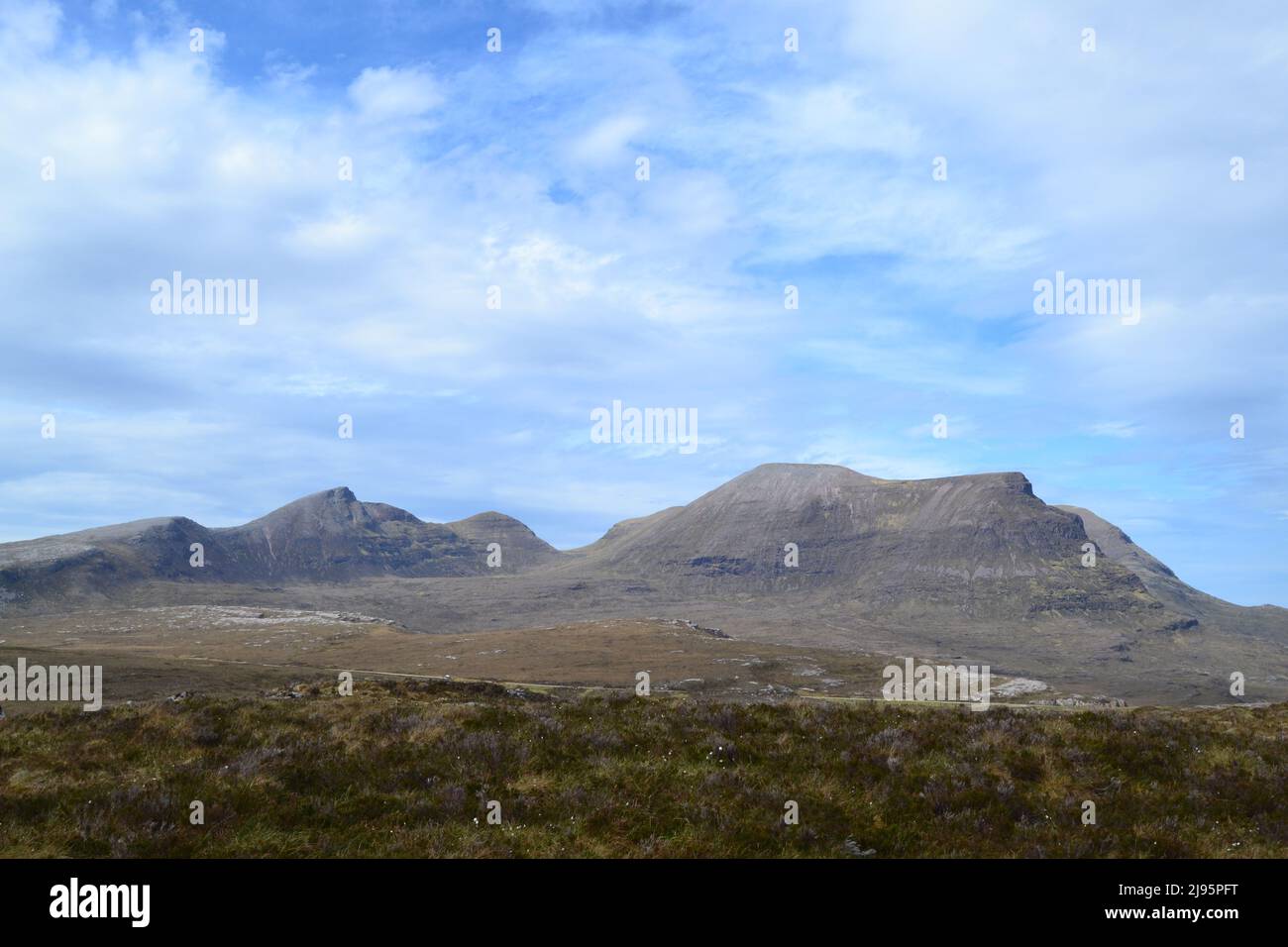 Quinag range in Sutherland and Assynt, NW Scotland, from across Loch na Gainmhich on a sunny day in spring. Not too high at 808 metres Stock Photo