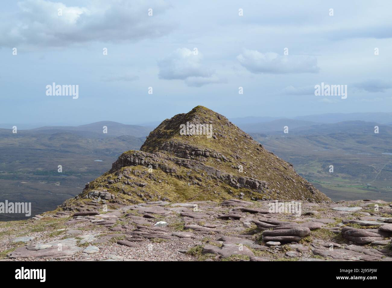 Ben Mor Coigach, a 700m ridge near Ullapool, hikers, walkers, views of Summer Isles and Suilven mountain, Stac Poilaidh and Cul Mor views Sandstone Stock Photo
