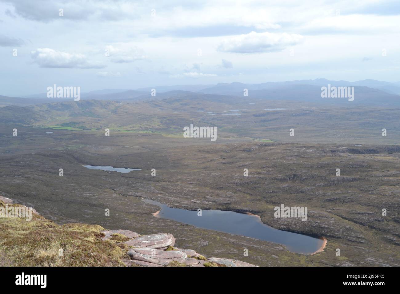 View from ridge of Ben Mor Coigach looking southeast across a lachlan to landscape near Ullapool, Ross and Cromarty, NW Scotland Stock Photo
