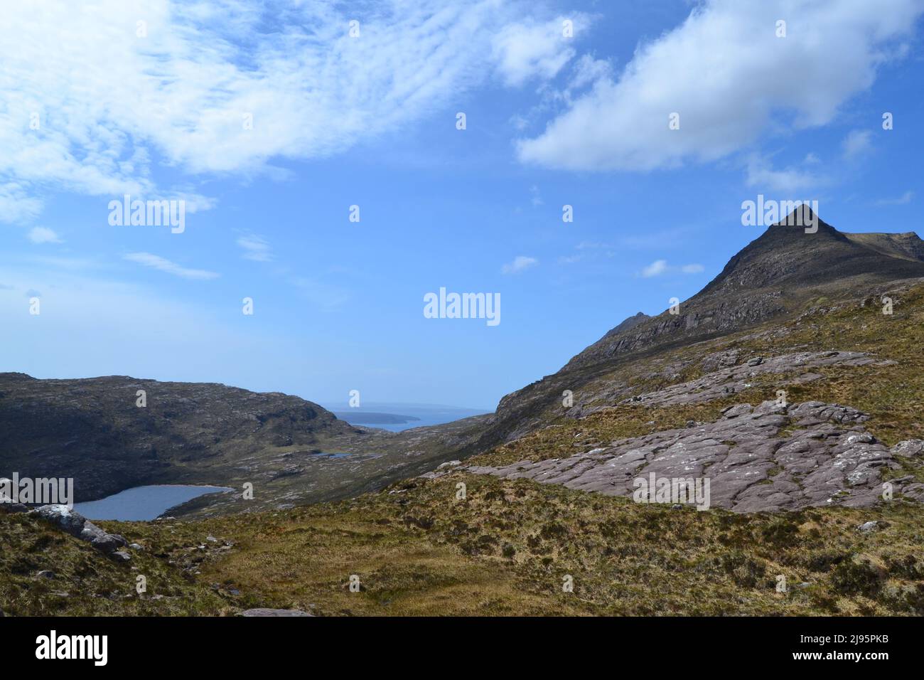 A lachlan and sea views below Ben Mor Coigach a high ridge north of Ullapool in Ross & Cromarty/Assynt. Looking southwest on a sunny spring day Stock Photo
