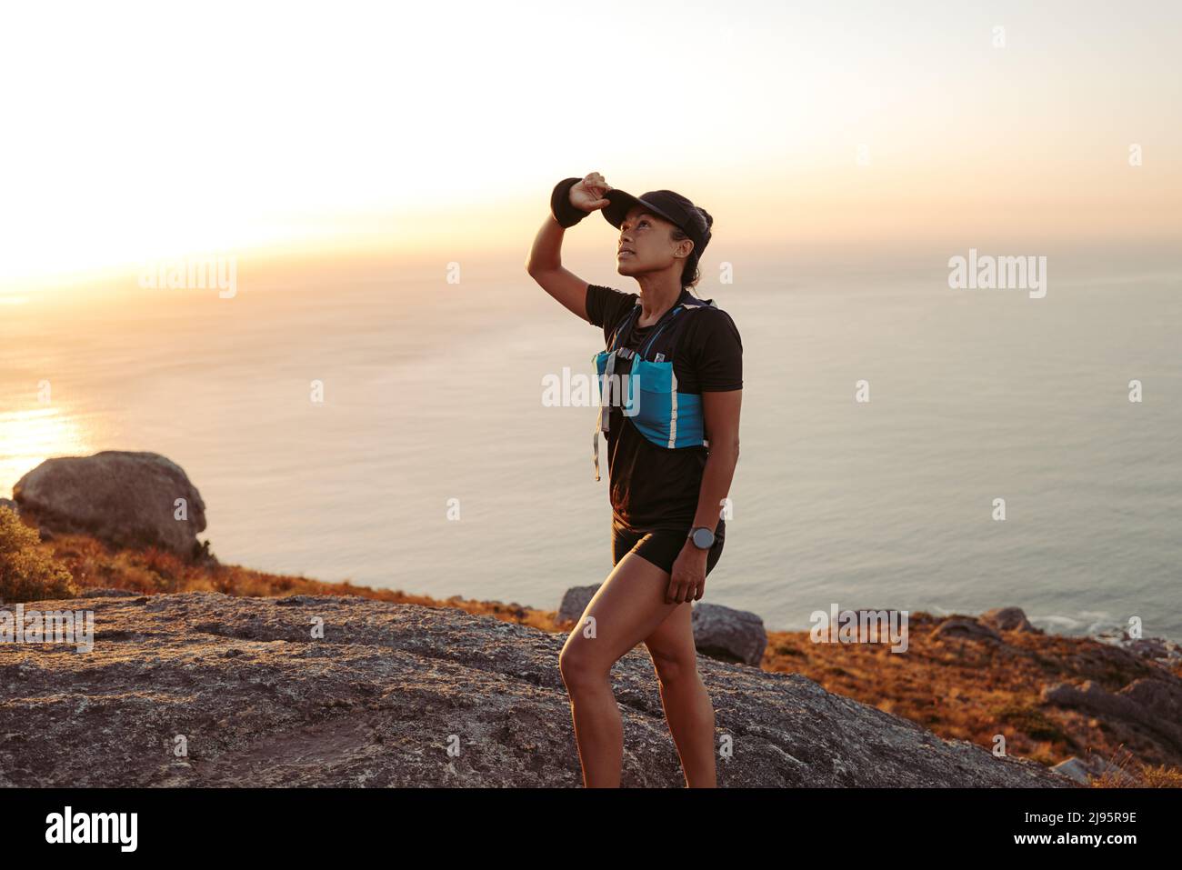 Woman walking up hill hi-res stock photography and images - Alamy