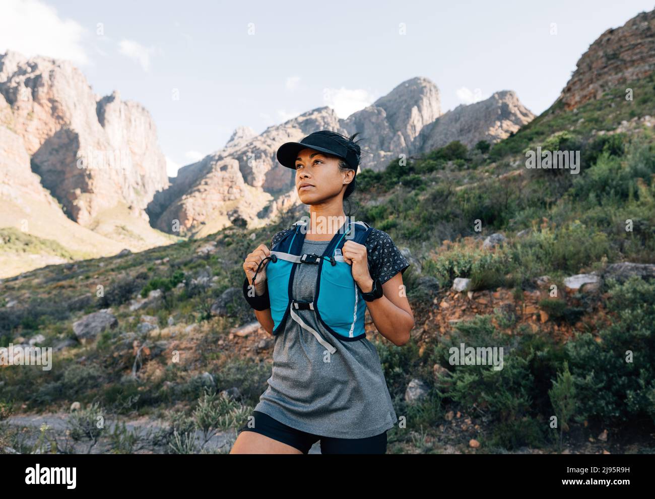 Woman hiker standing in valley hi-res stock photography and images - Alamy