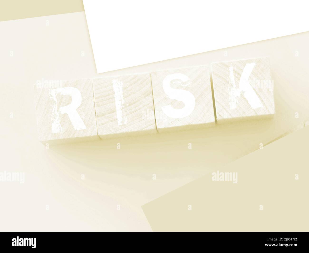 Word Risk Box Risk Word On wooden cubes with pink wallet besides on pink background ...