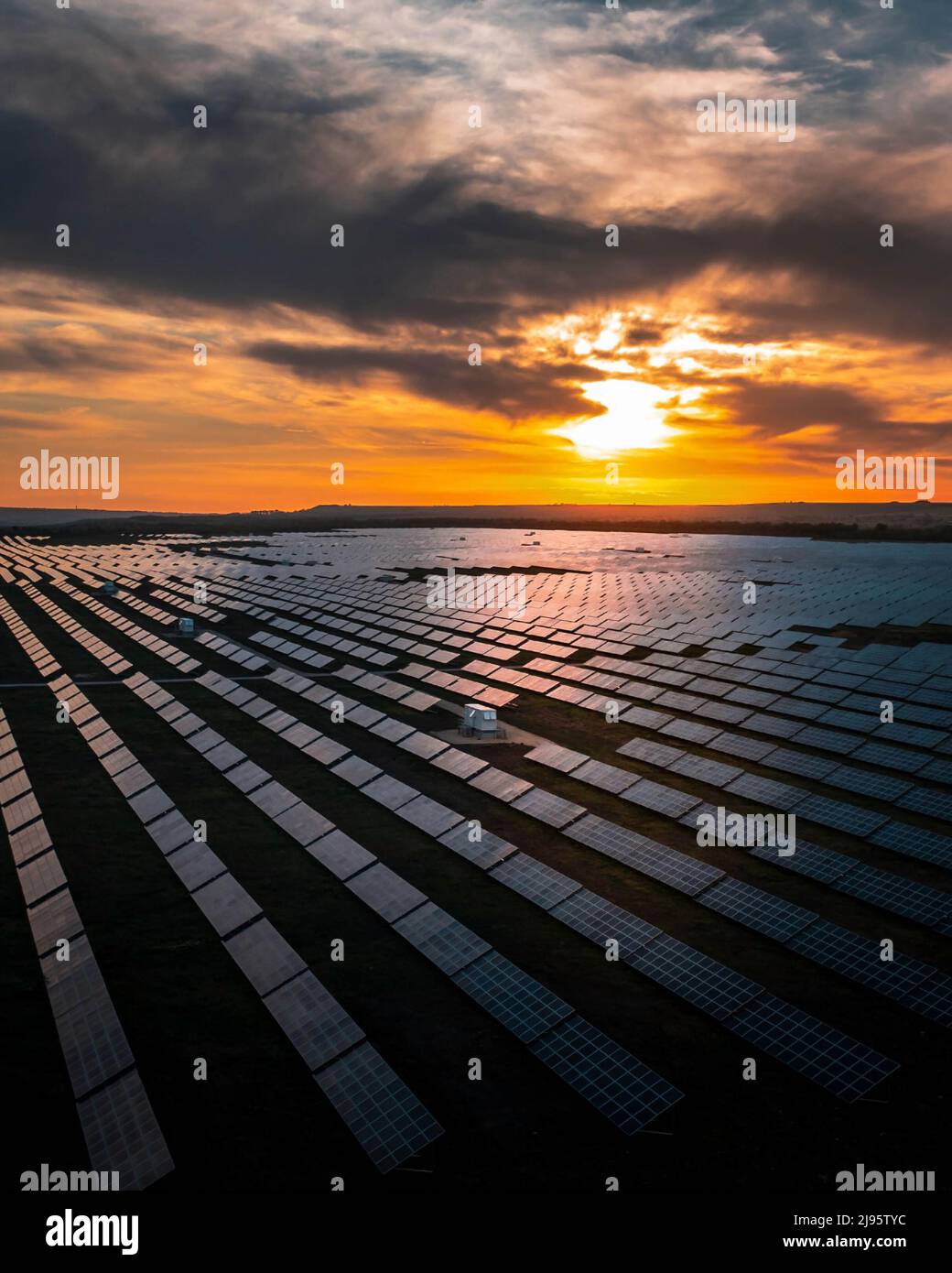 Aerial view of Long Rows of Solar Panels at Sunset Stock Photo - Alamy