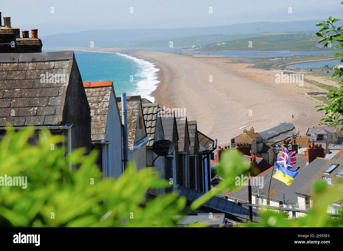 Chesil Beach. 20th May 2022. UK Weather. Platinum Jubilee flag flutters