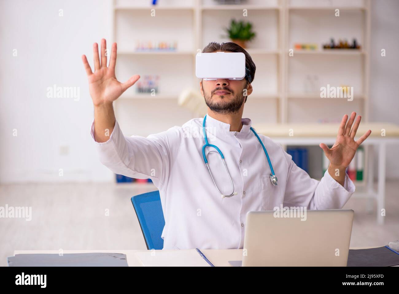 Physician wearing augmented reality glasses hi-res stock photography ...