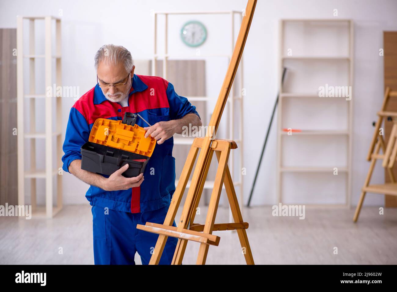 Repairing Draw Old carpenter repairing drawing easel Stock Photo - Alamy