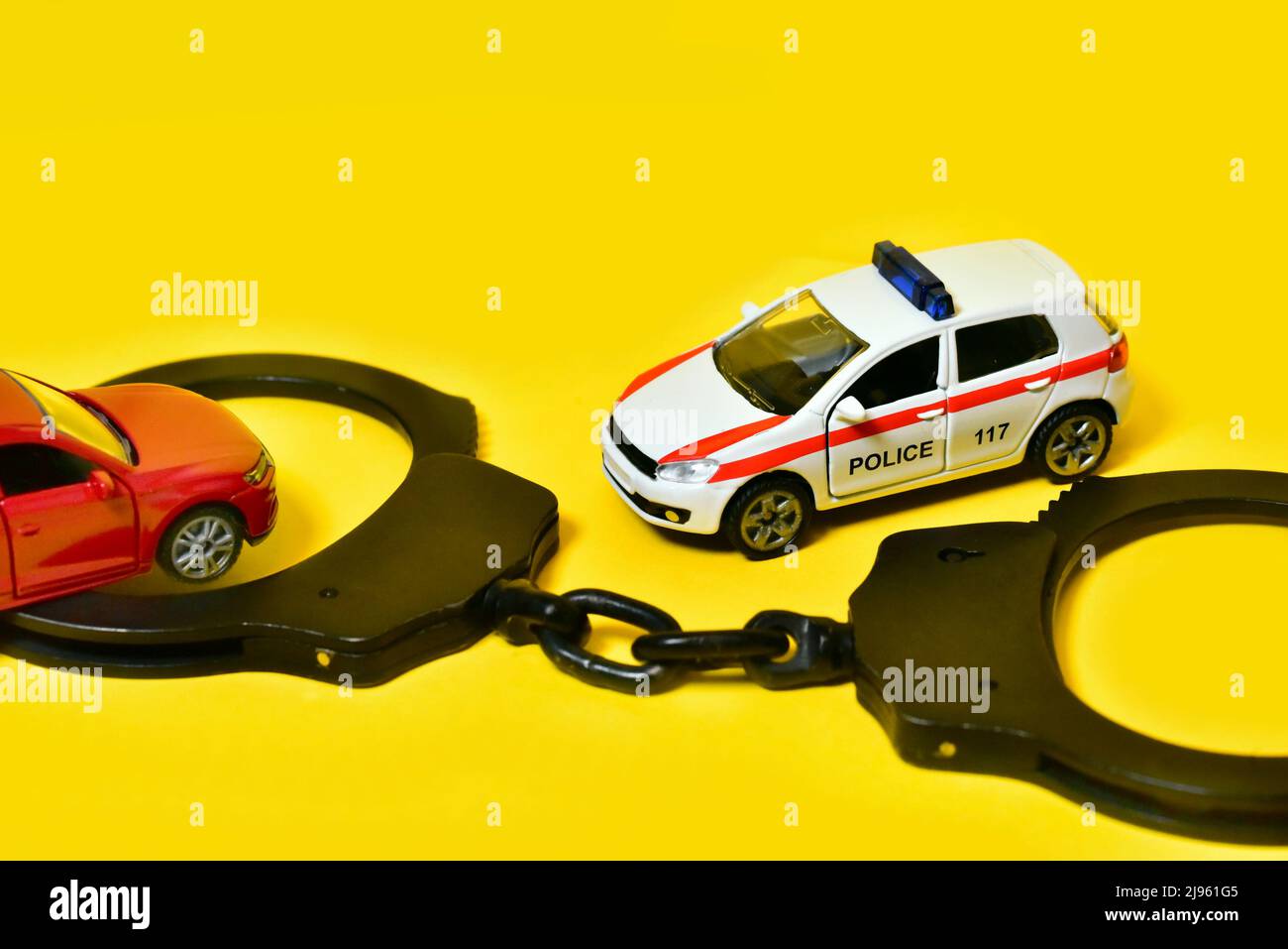 police toy car with handcuffs Stock Photo