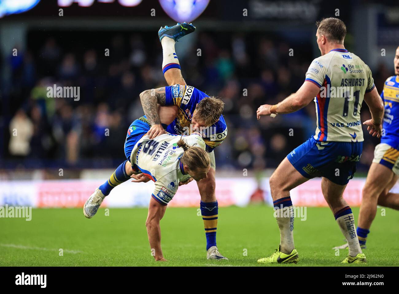 Jacob Miller #6 of Wakefield Trinity is is tackled by Blake Austin of ...