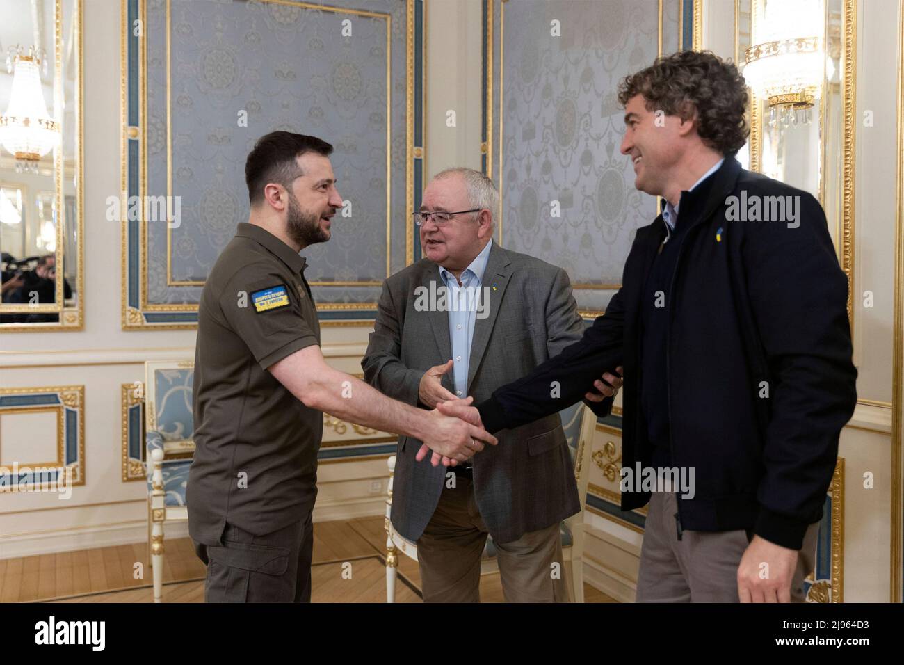 Kyiv, Ukraine. 20th May, 2022. Ukrainian President Volodymyr Zelenskyy, shakes hands with Senator Mark Daly, right, leader of the Irish Senate as Sean O Fearghail, center, Chairperson of the Lower House of the Irish Parliament looks on at the Mariinsky Palace, May 20, 2022 in Kyiv, Ukraine. Credit: Ukraine Presidency/Ukraine Presidency/Alamy Live News Stock Photo