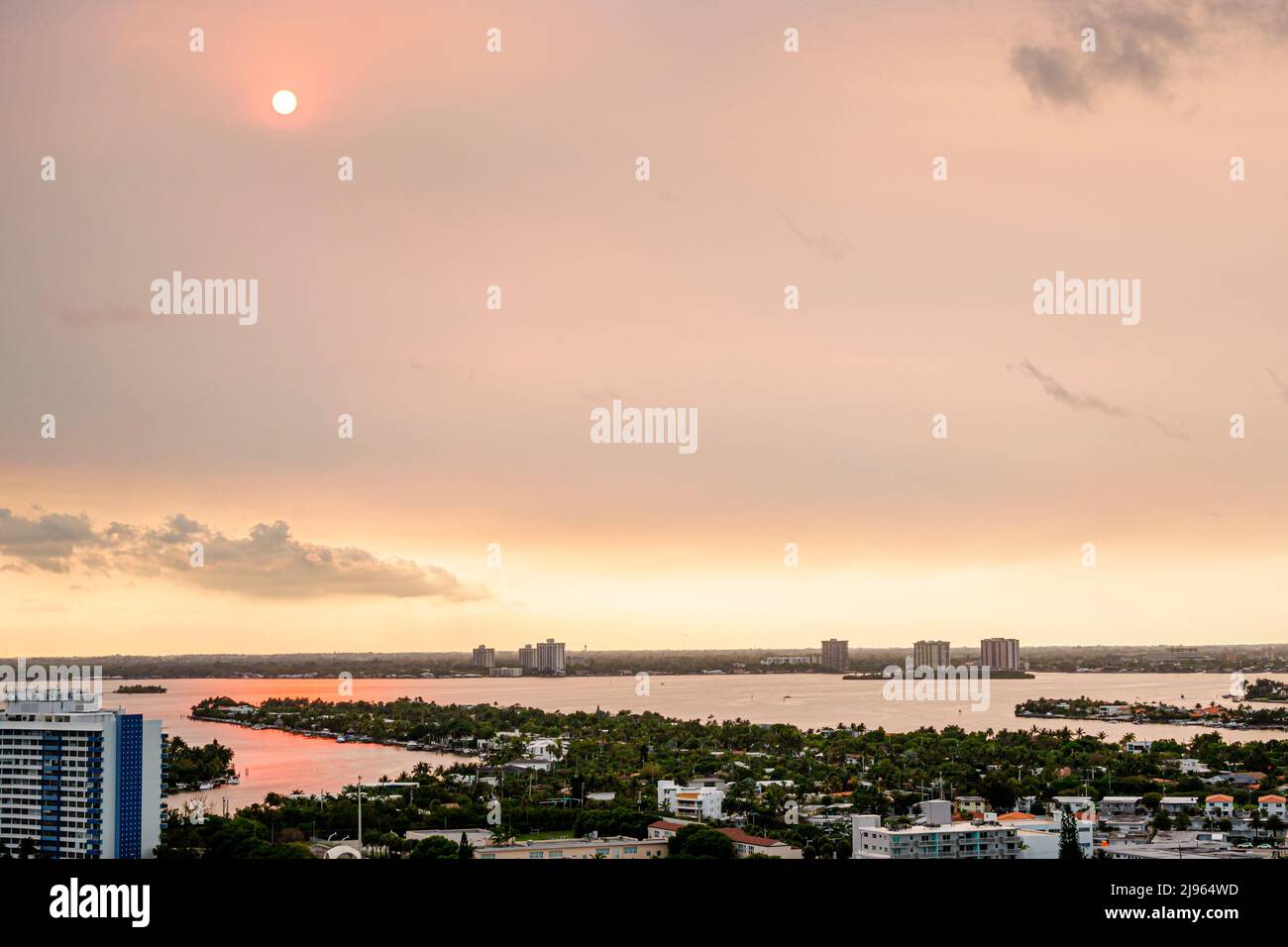 Miami Beach Florida,Biscayne Point Bay water smoke from Everglades fire,global warming climate crisis change sun sky Stock Photo