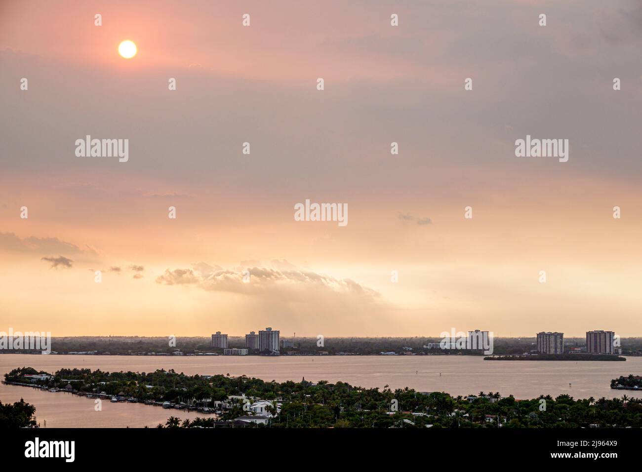 Miami Beach Florida,Biscayne Point Bay water smoke from Everglades fire,global warming climate crisis change sun sky Stock Photo
