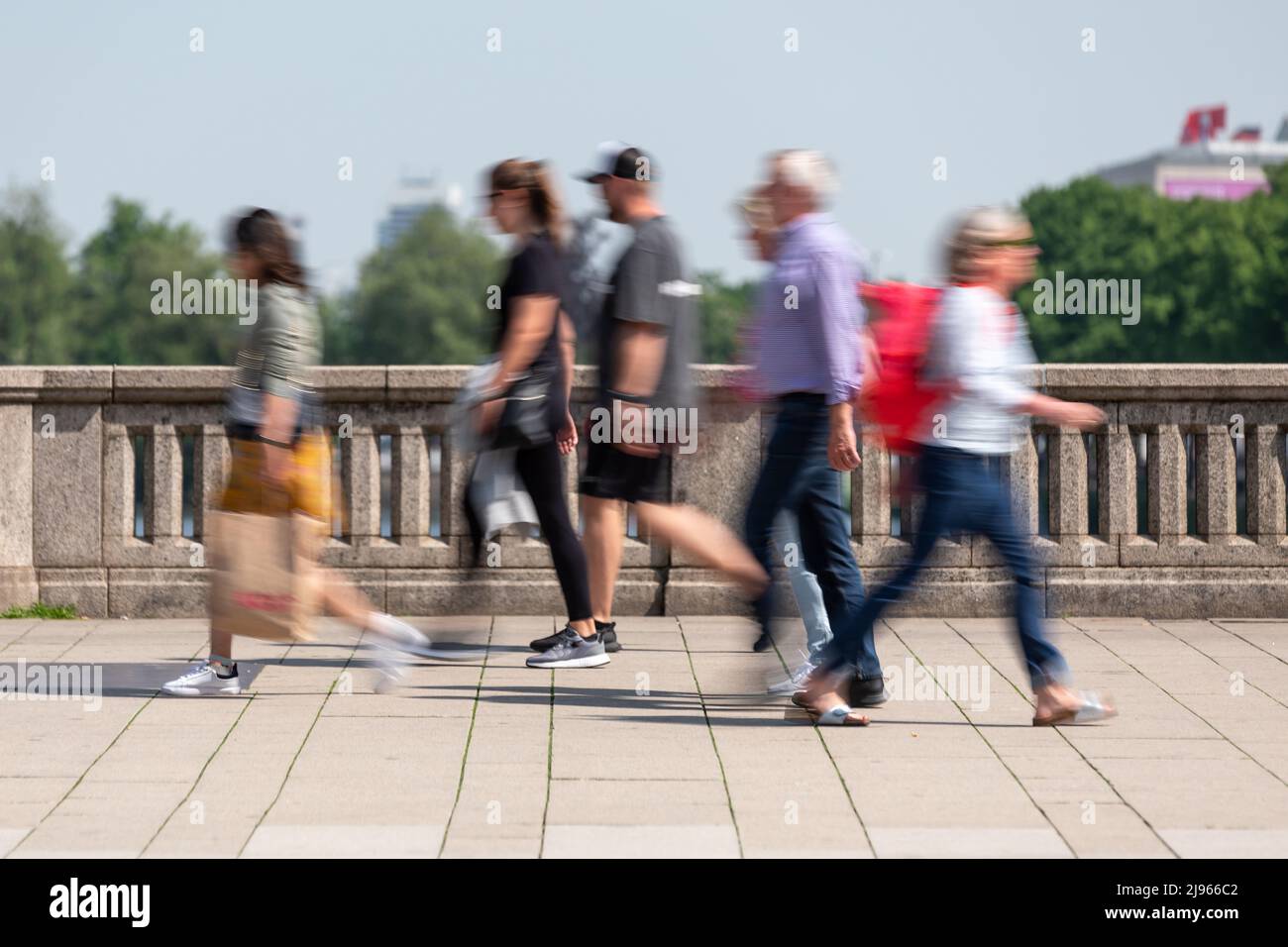 Pedestrians in motion blurred by long exposure Stock Photo