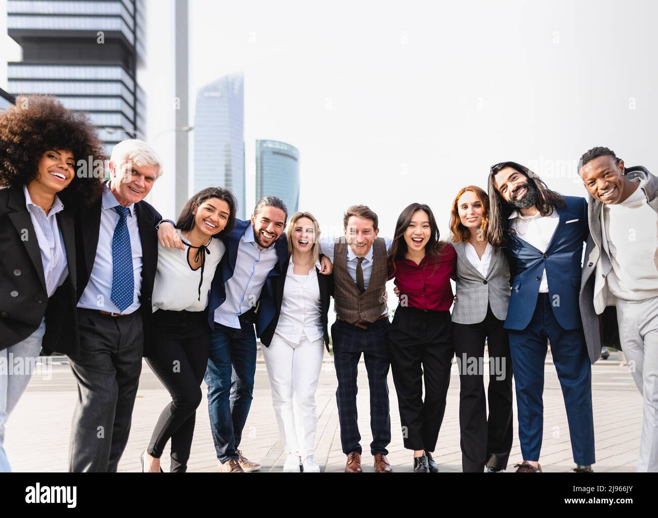 Team of multiracial business people with different ages and ethnicities standing in the city center during meeting work Stock Photo