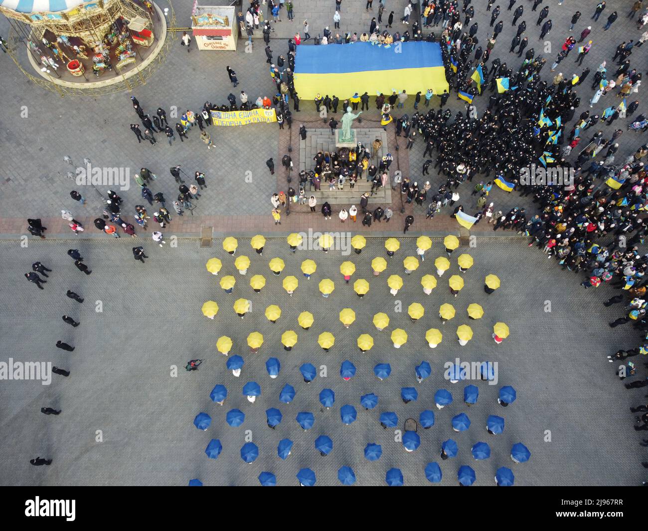 Odessa, Ukraine. 16th Feb, 2022. (EDITOR'S NOTE: Image taken with a  drone).Aerial view of flash mob with umbrellas in the colors of the  national flag of Ukraine near the monument of Duc