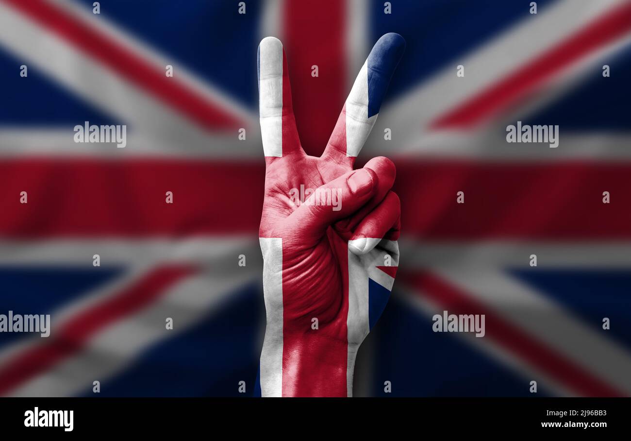 Hand making the V victory sign with flag of united kingdom Stock Photo