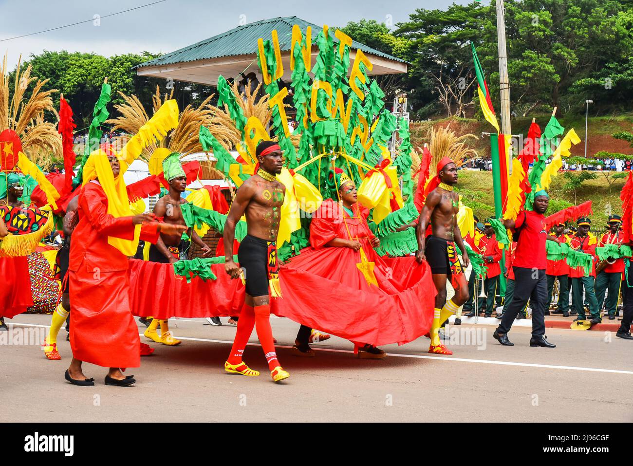 Yaounde, Cameroon. 20th May, 2022. People take part in a parade to