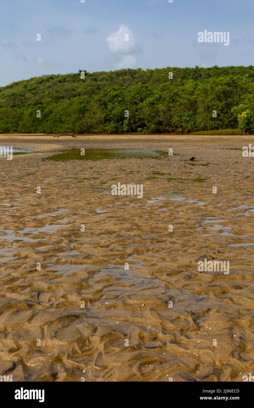Beautiful and natural water flow design seen on sand in shallow areas of Karli River Stock Photo