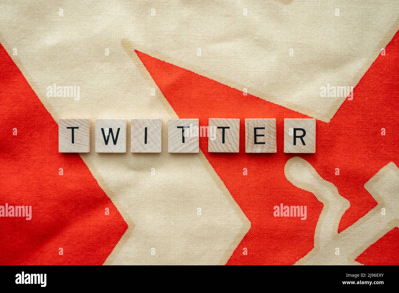 Twitter left wing bias concept on red flag. Stock Photo