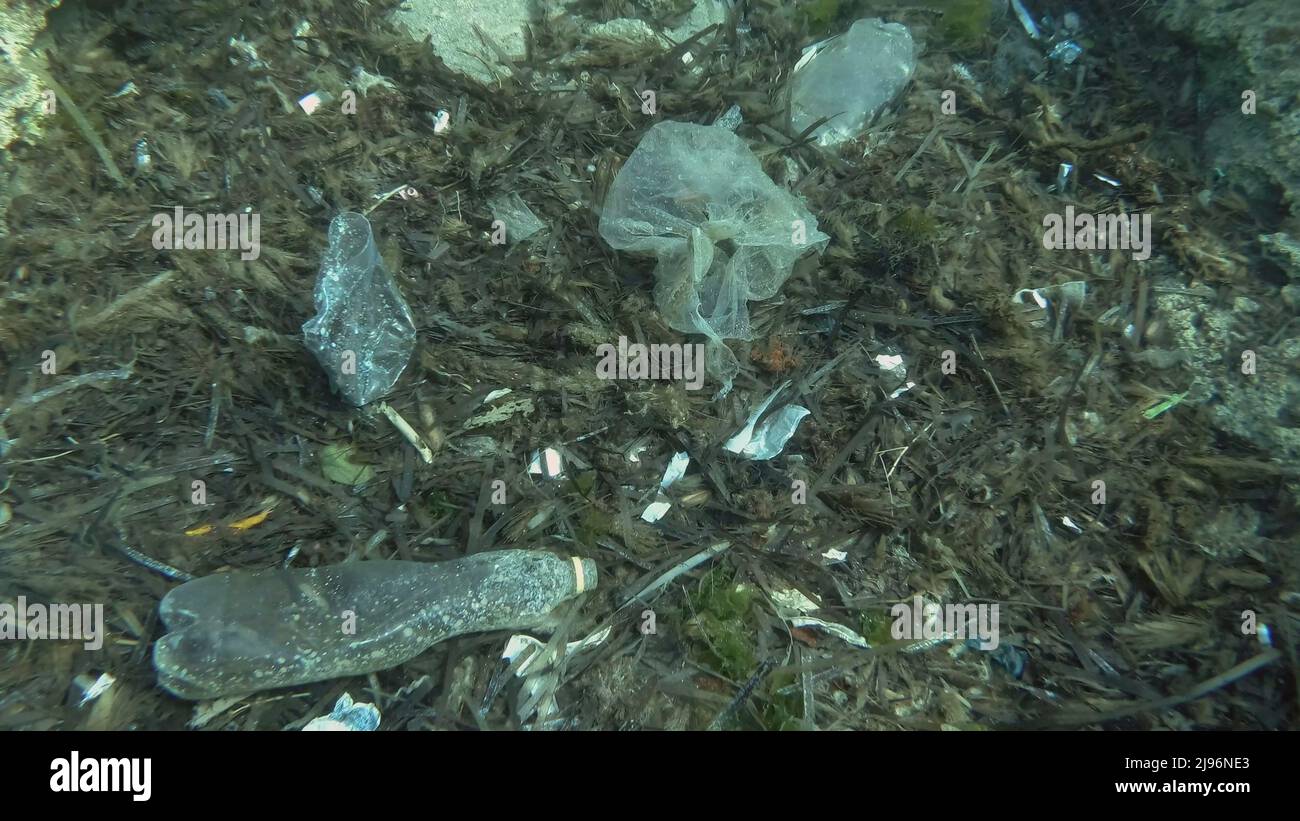 Mediterranean Sea, Rhodes, Greece. 26th Mar, 2019. Massive plastic pollution of the ocean bottom. Seabed covered with a lot of plastic garbage. Bottles, bags and other plastic debris on seabed in Mediterranean Sea. Plastic pollution of the Ocean (Credit Image: © Andrey Nekrasov/ZUMA Press Wire) Stock Photo