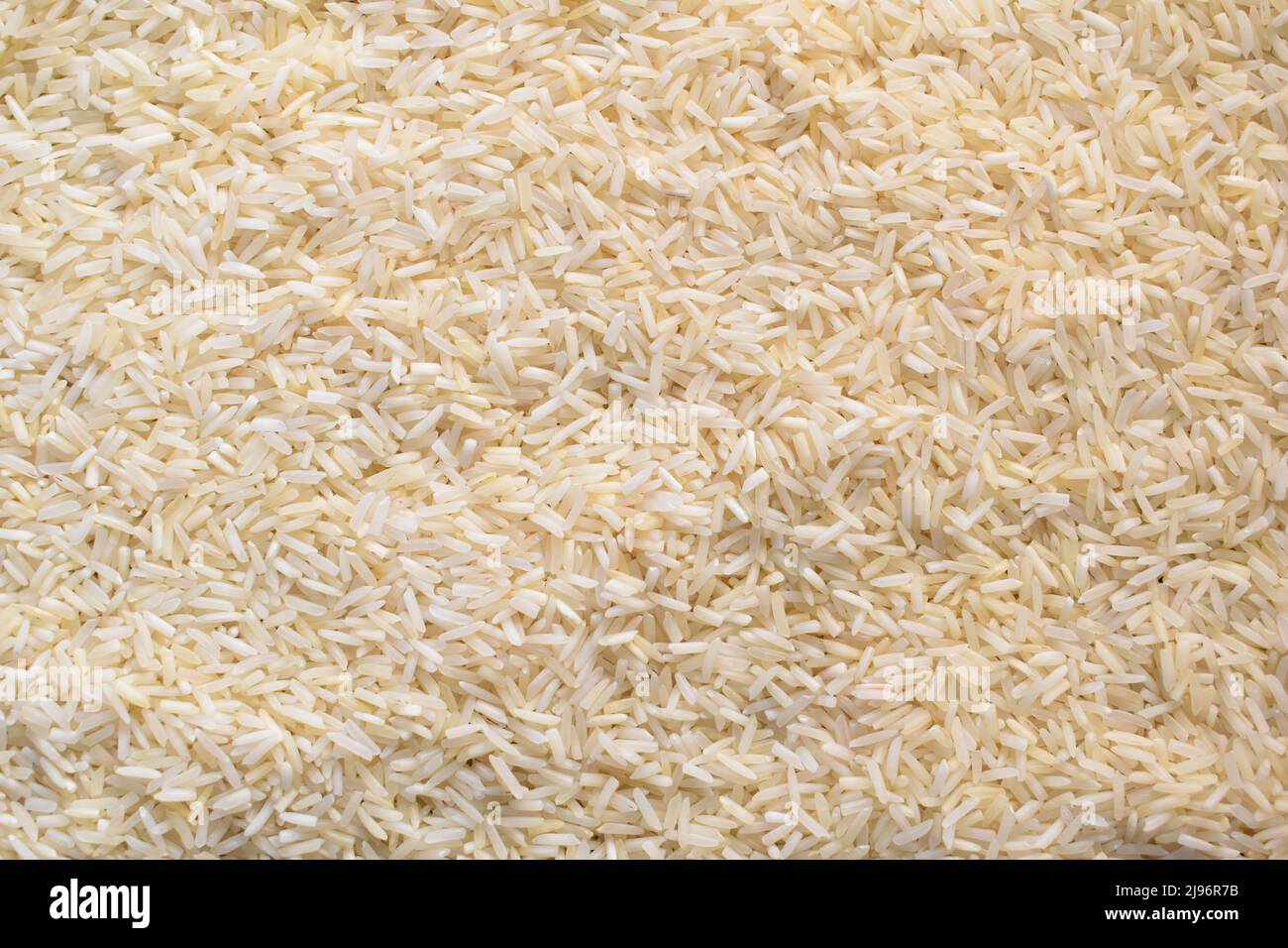 Raw whole dried Basmati rice Stock Photo Alamy