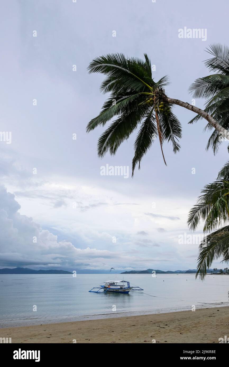 Port Barton, Philippines - May 2022: A fishing boat on the beach at Port Barton on May 16 2022 in Palawan, Philippines. Stock Photo
