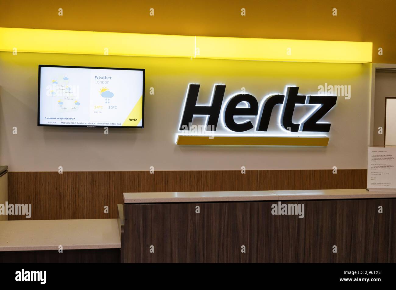 Gatwick Airport, UK- May 3, 2022: Hertz car rental desk at Gatwick Airport Stock Photo